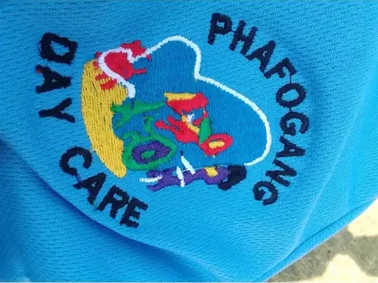 Phafogang Day Care logo embroidered on a blue shirt